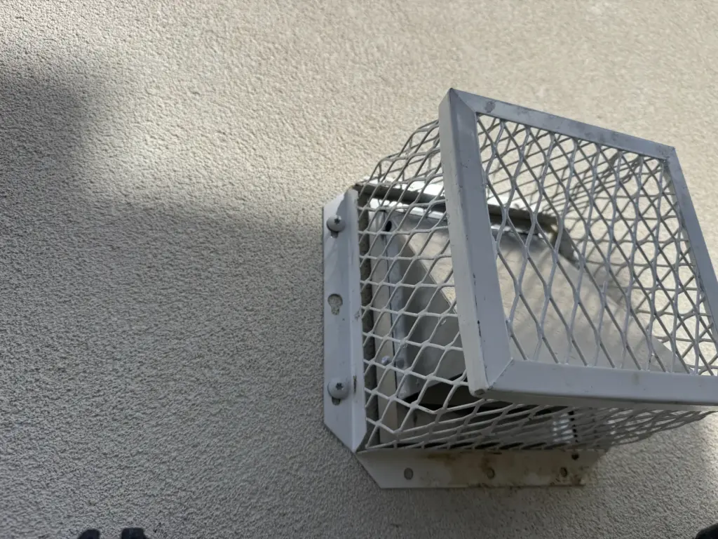 Exterior bird vent guard installed to help prevent birds from entering a building vent