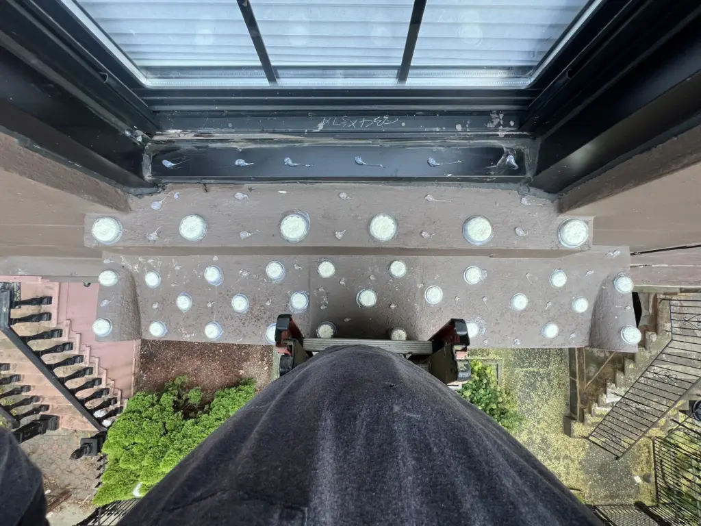 Optical bird gel installed along a balcony underside and ledge area in NYC